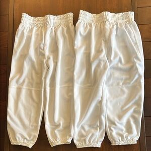 NWT. 2pairs of white boys baseball pants. Perfect condition.